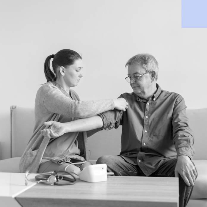 carer testing blood pressure